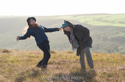 Mary and Jessica on a windy mountain top