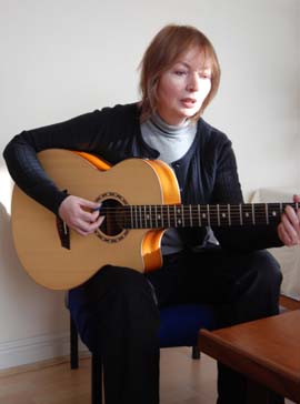 Mary Hopkin playing guitar